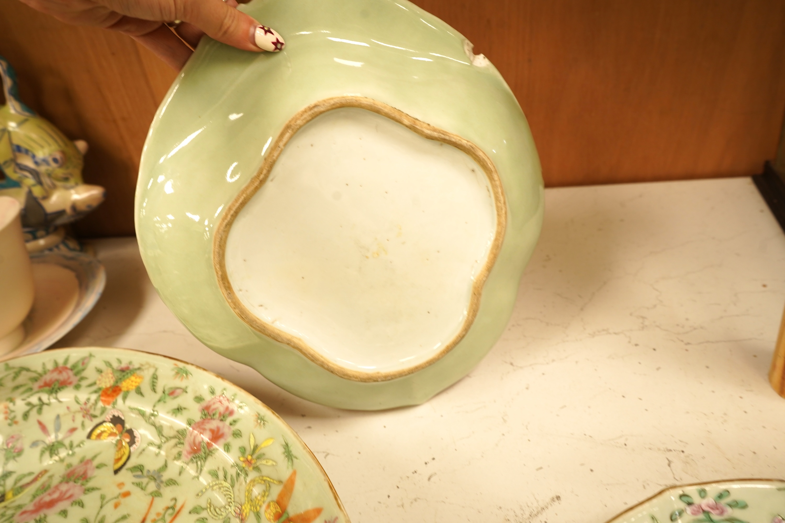 A Chinese celadon ground famille rose dish and two similar dessert dishes, c.1830, meat dish 42cm wide